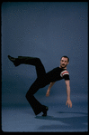 Publicity shot of director/choreographer Michael Bennett dancing in studio (New York)