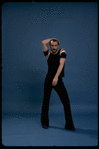 Publicity shot of director/choreographer Michael Bennett dancing in studio (New York)