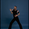 Publicity shot of director/choreographer Michael Bennett dancing in studio (New York)