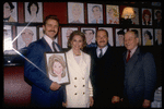 Actors (L-2L) John Schneider & Cyd Charisse, producer Sam Crothers, and restaurateur Vincent Sardi at hanging of Ms. Charisse's caricature on the wall of Sardi's restaurant to honor her Broadway debut in musical "Grand Hotel" (New York)