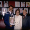 Actors (L-C) John Schneider & Cyd Charisse with restaurateur Vincent Sardi at hanging of Ms. Charisse's caricature on the wall of Sardi's restaurant to honor her Broadway debut in musical "Grand Hotel" (New York)