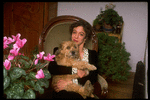 Dancer/choreographer/director Martha Clarke with pet dog at home (New York)