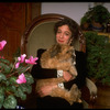 Dancer/choreographer/director Martha Clarke with pet dog at home (New York)