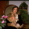 Dancer/choreographer/director Martha Clarke with pet dog at home (New York)