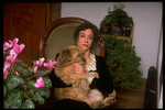 Dancer/choreographer/director Martha Clarke with pet dog at home (New York)