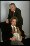 Portrait of theatrical producers Alexander Cohen & wife Hildy Parks with pet dog (New York)