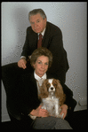 Portrait of theatrical producers Alexander Cohen & wife Hildy Parks with pet dog (New York)