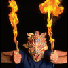 Publicity shot of performer Fred Curchack wearing mask in theater piece "The Stuff That Dreams Are Made Of" at the Brooklyn Academy of Music (New York)