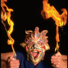 Publicity shot of performer Fred Curchack wearing mask in theater piece "The Stuff That Dreams Are Made Of" at the Brooklyn Academy of Music (New York)