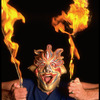 Publicity shot of performer Fred Curchack wearing mask in theater piece "The Stuff That Dreams Are Made Of" at the Brooklyn Academy of Music (New York)