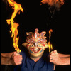 Publicity shot of performer Fred Curchack wearing mask in theater piece "The Stuff That Dreams Are Made Of" at the Brooklyn Academy of Music (New York)