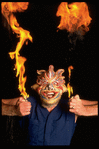 Publicity shot of performer Fred Curchack wearing mask in theater piece "The Stuff That Dreams Are Made Of" at the Brooklyn Academy of Music (New York)