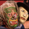Publicity shot of performer Fred Curchack wearing mask in theater piece "The Stuff That Dreams Are Made Of" at the Brooklyn Academy of Music (New York)