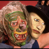 Publicity shot of performer Fred Curchack wearing mask in theater piece "The Stuff That Dreams Are Made Of" at the Brooklyn Academy of Music (New York)