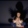Publicity shot of performer Fred Curchack wearing mask in theater piece "The Stuff That Dreams Are Made Of" at the Brooklyn Academy of Music (New York)