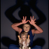 Publicity shot of performer Fred Curchack wearing mask in theater piece "The Stuff That Dreams Are Made Of" at the Brooklyn Academy of Music (New York)