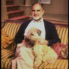 Playwright Larry Kramer with pet dog on the set of his play "Just Say No" (New York)