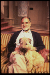 Playwright Larry Kramer with pet dog on the set of his play "Just Say No" (New York)