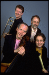 Publicity photo of Jay Leonhart Quartet; musicians (Front L-R) Jay Leonhart & David Samuels, (Top L-R) Jim Pugh & Terry Clarke (New York)