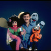 Publicity photo of ventriloquist Ronn Lucas with his puppets (New York)
