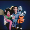 Publicity photo of ventriloquist Ronn Lucas with his puppets (New York)