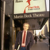 Playwright Terrence McNally standing in front of Martin Beck Theater where his musical, "The Rink" is playing (New York)