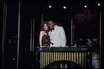 Singer/actress Bette Midler and musician Lionel Hampton in scene from Broadway concert "Clams on the Half Shell" (New York)