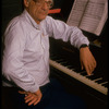 Publicity photo of playwright Arthur Miller at piano during rehearsal for his show "Up from Paradise" (New York)