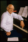 Publicity photo of playwright Arthur Miller at piano during rehearsal for his show "Up from Paradise" (New York)