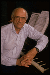 Publicity photo of playwright Arthur Miller at piano during rehearsal for his show "Up from Paradise" (New York)