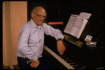 Publicity photo of playwright Arthur Miller at piano during rehearsal for his show "Up from Paradise" (New York)