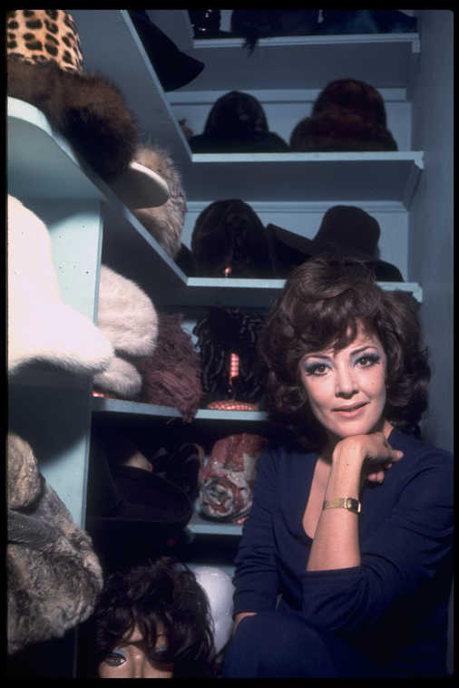 Woman Standing in Hat Closet