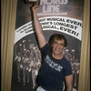 Producer Joseph Papp posing in front of Shubert Theatre with top hat from "A Chorus Line" on occasion of it becoming the longest running Broadway musical (New York)