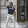 Producer Joseph Papp posing in front of Shubert Theatre with top hat from "A Chorus Line" on occasion of it becoming the longest running Broadway musical (New York)