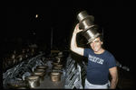 Producer Joseph Papp posing with top hats from "A Chorus Line" on occasion of it becoming the longest running Broadway musical (New York)