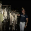 Producer Joseph Papp posing with top hat & costumes from "A Chorus Line" on occasion of it becoming the longest running Broadway musical (New York)