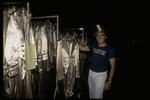 Producer Joseph Papp posing with top hat & costumes from "A Chorus Line" on occasion of it becoming the longest running Broadway musical (New York)