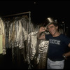 Producer Joseph Papp posing with top hat & costumes from "A Chorus Line" on occasion of it becoming the longest running Broadway musical (New York)