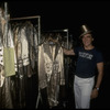 Producer Joseph Papp posing with top hat & costumes from "A Chorus Line" on occasion of it becoming the longest running Broadway musical (New York)