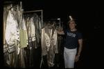 Producer Joseph Papp posing with top hat & costumes from "A Chorus Line" on occasion of it becoming the longest running Broadway musical (New York)