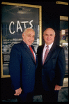 Producers (L-R) Bernard Jacobs & Gerald Schoenfeld in front of Winter Garden Theater, housing their production of musical "Cats" (New York)