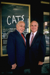 Producers (L-R) Bernard Jacobs & Gerald Schoenfeld in front of Winter Garden Theater, housing their production of musical "Cats" (New York)