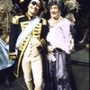 Actor (fr., R) Dennis King, in cross-dressing, w. cast members in a scene fr. the Broadway play "A Patriot For Me." (New York)
