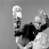 Judith Fugate as Clara, John-Pierre Frohlich as the nephew and  Shaun O'Brien as Drosselmeyer, in a New York City Ballet production of "The Nutcracker."