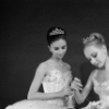 Kay Mazzo and Suki Schorer sewing ribbons on shoes, in a New York City Ballet production of "The Nutcracker." (New York)