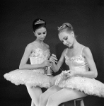 Kay Mazzo and Suki Schorer sewing ribbons on shoes, in a New York City Ballet production of "The Nutcracker." (New York)