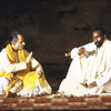 Actors (L-R) Urs Bihler and Mamadou Dioume in a scene from the Paris production of the play cycle "The Mahabharata." (Paris)