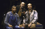 Actors (L-R) Roger Robinson, Edward Seamon and Jay Patterson in a scene from the Roundabout Theatre's production of the play "Of Mice And Men." (New York)