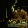 Actors Byron Jennings (L) and Anthony LaPaglia looking at ptgs. in scene from off-Broadway production of Steve Tesich play "On the Open Road"