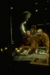 Actors Byron Jennings (L) and Anthony LaPaglia looking at ptgs. in scene from off-Broadway production of Steve Tesich play "On the Open Road"